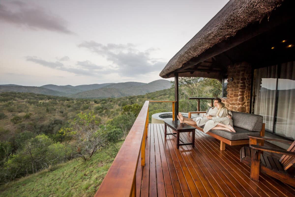 Leopard-Mountain-Safari-Lodge-accommodation-luxury-chalet-deck-couple