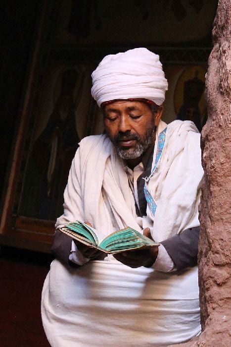 Priest Reading at Lalibela Church in Ethiopia