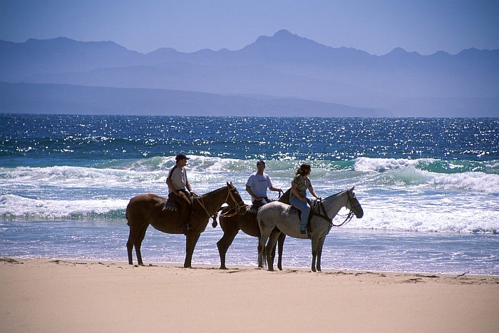 Horse-riding on Lookout beach at Plettenberg Bay