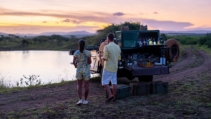 Best game reserves in South Africa - couple on a sundowner drinks stop at a Kruge private reserve