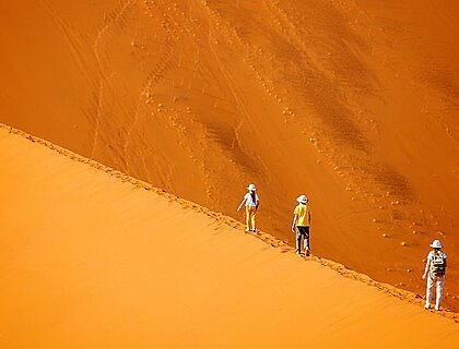 Family safaris in Africa - walking up Big Daddy at Sossusveli in Namibia