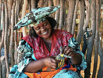 Windhoek - Herrero lady selling crafts