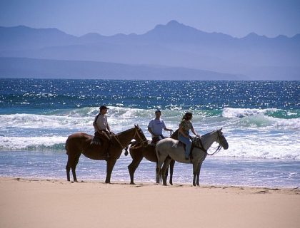 Horse-riding on Lookout beach at Plettenberg Bay