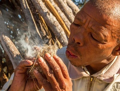 Leaning how the Bushmen create fire in the Central Kalahari