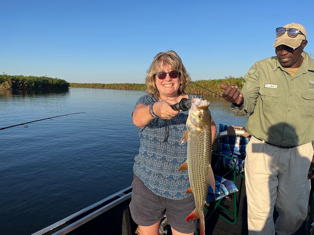 Kate catching her first tiger fish