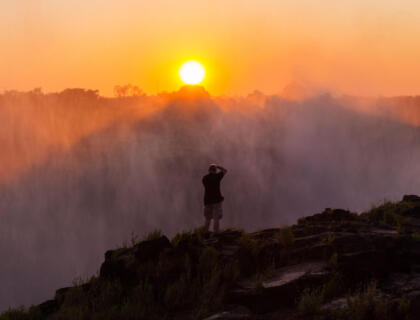 Taking photos at sunset of Victoria Falls