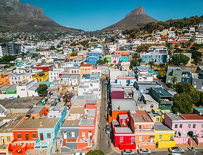 View of the colorful Bo-Kaap in Cape Town, South Africa. A popular daytime destination, hillside Bo-Kaap is known for its narrow cobbled streets lined with colorful houses