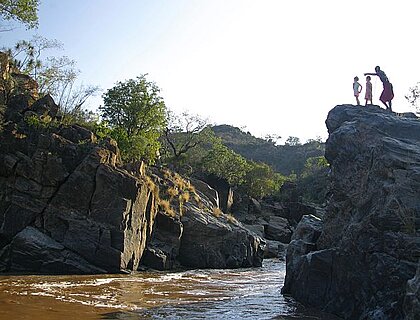 Kenya family safaris - masaai guide with kids at Sabuk