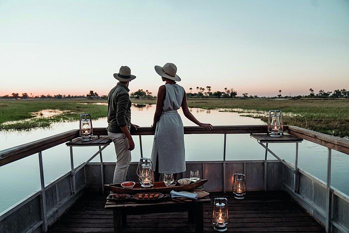 Couple in the Okavango Delta, Botswana, photo courtesy of Eagle Island Lodge