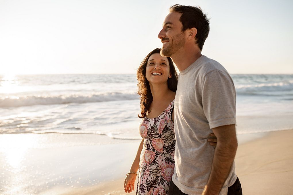 Couple enjoying a walk on a Cape Town beach